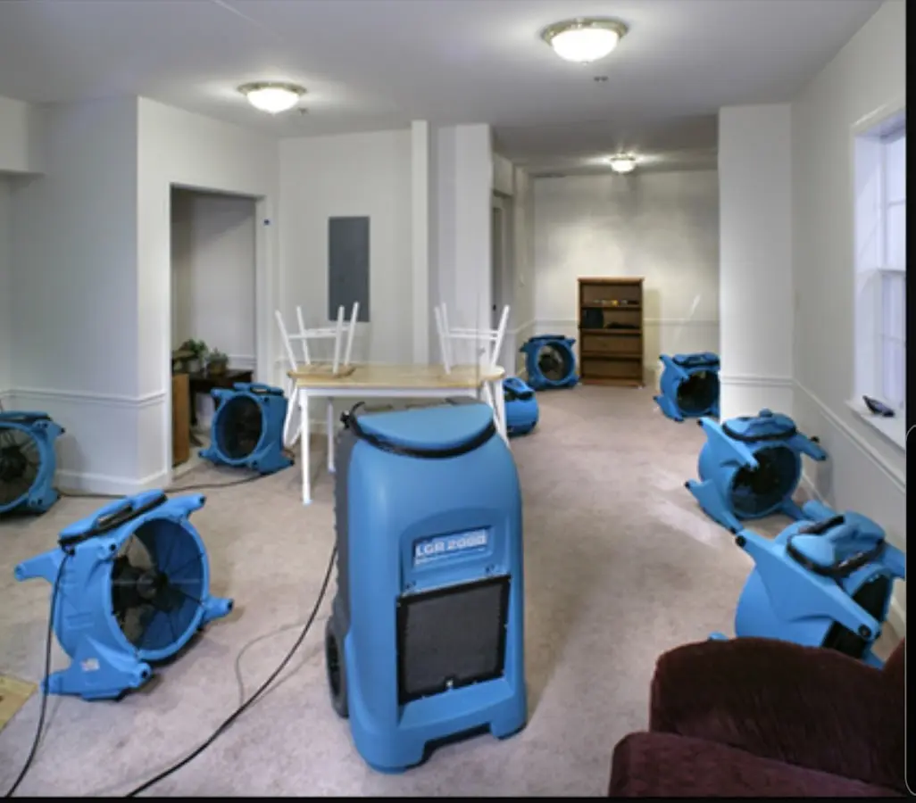 Air movers and dehumidifier setup for Water Damage Restoration in Cramerton